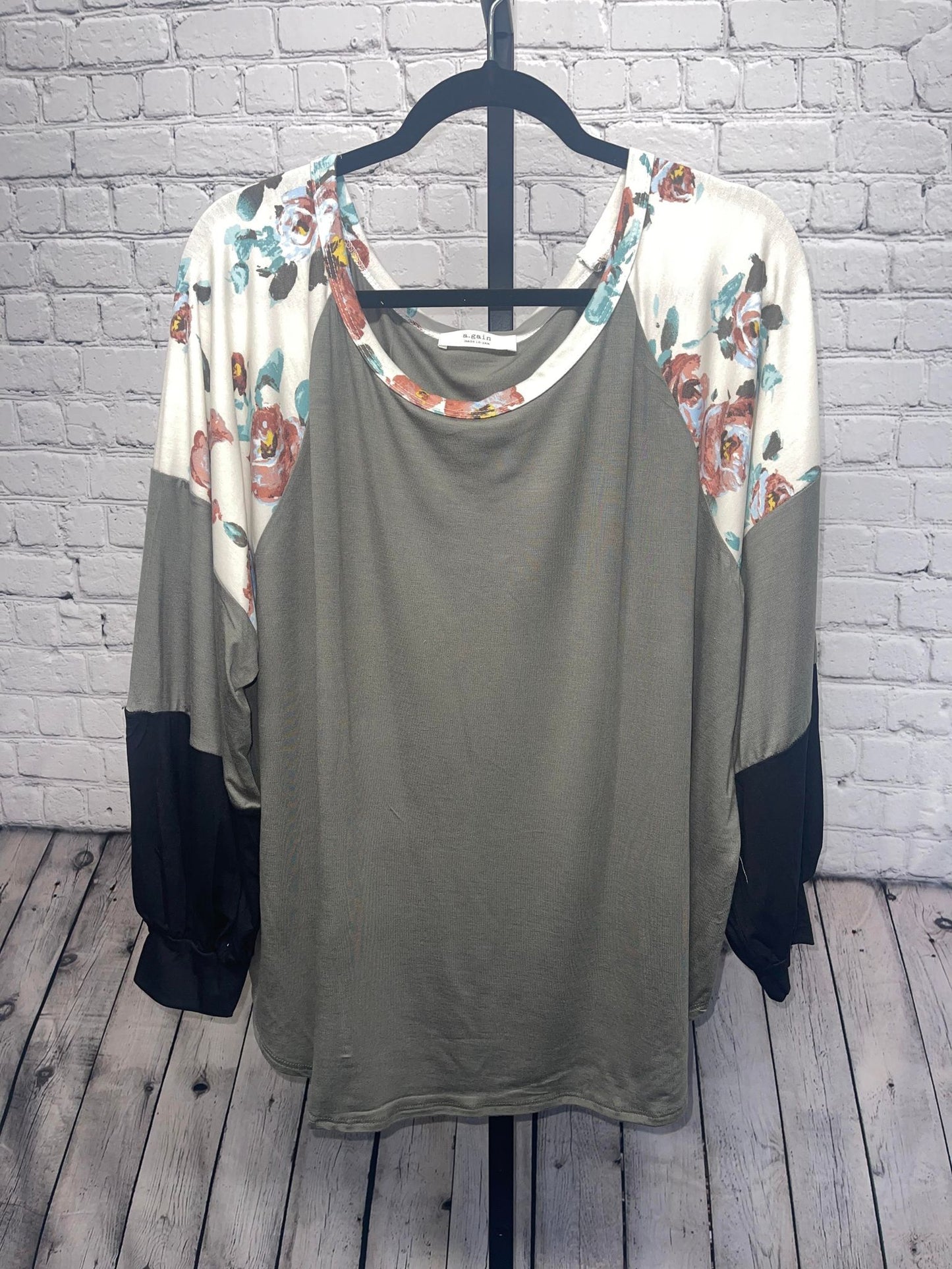 Plus size partially floral color block long sleeve top