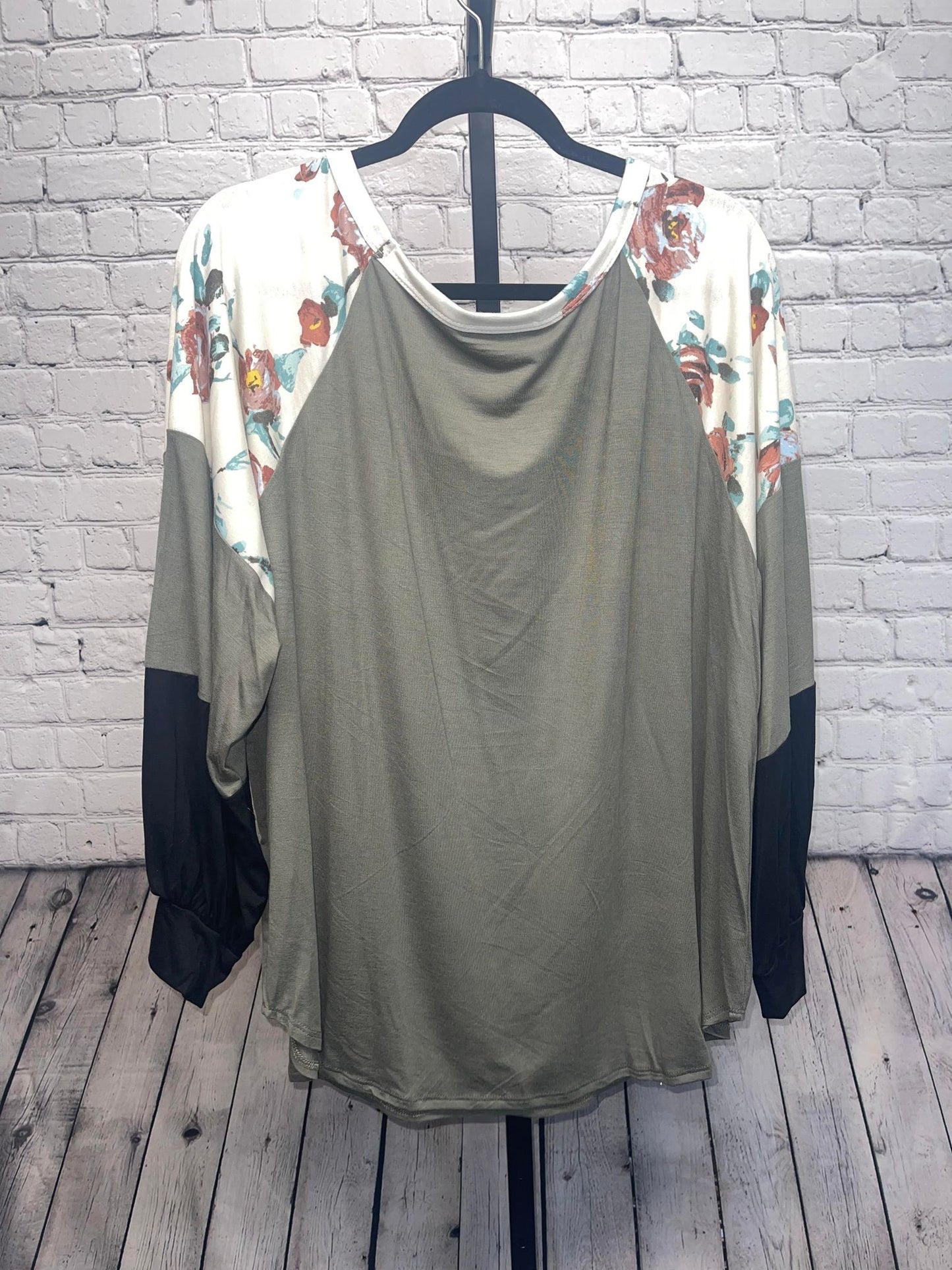Plus size partially floral color block long sleeve top